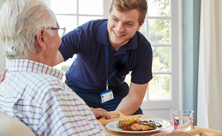 Senior Man Served a Meal